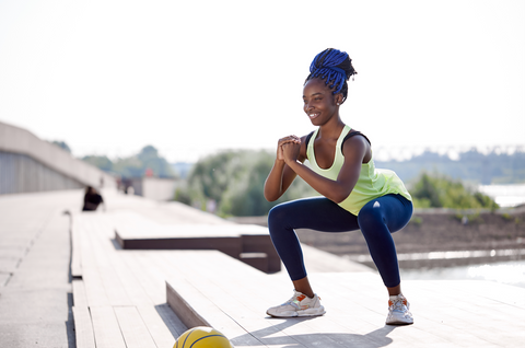 Woman exercising outdoors on a sunny day